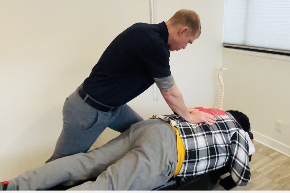 Back pain treatment using rehabilitation-focused chiropractic care in St. Peter, MN