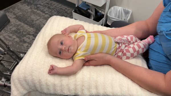 Dr. Andrea performing a gentle infant spinal evaluation at Rising Sun Chiropractic in St. Peter MN